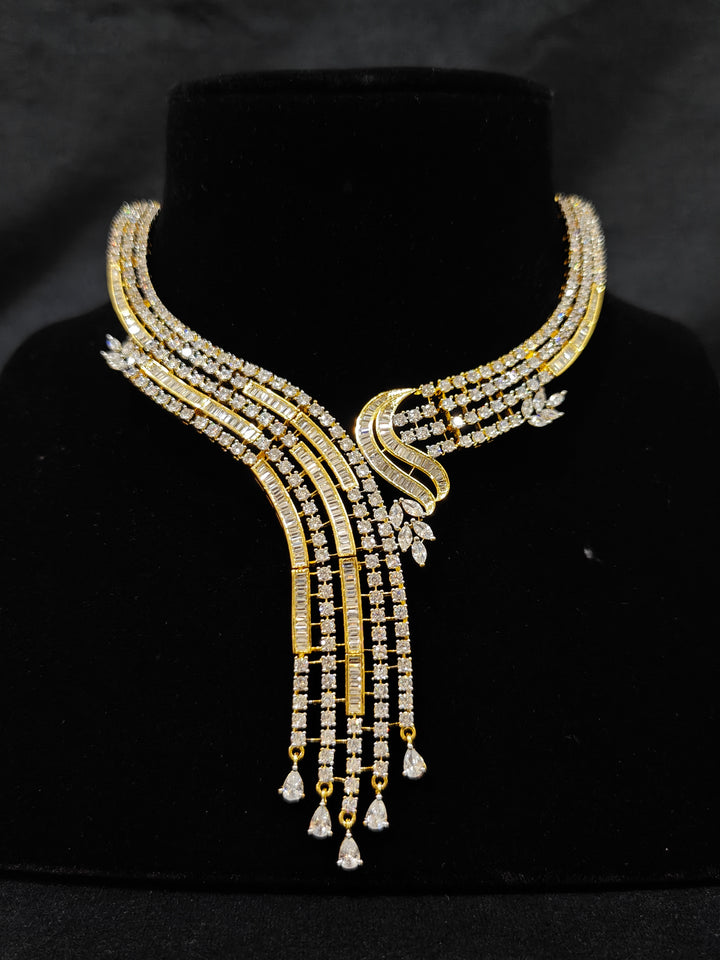 Close-up of an ornate Western gold Diamond Collar jewellery set and earrings with American Diamond. Close-up of a cocktail party look featuring a premium American diamond necklace. Perfect Necklace Set for Party wear.