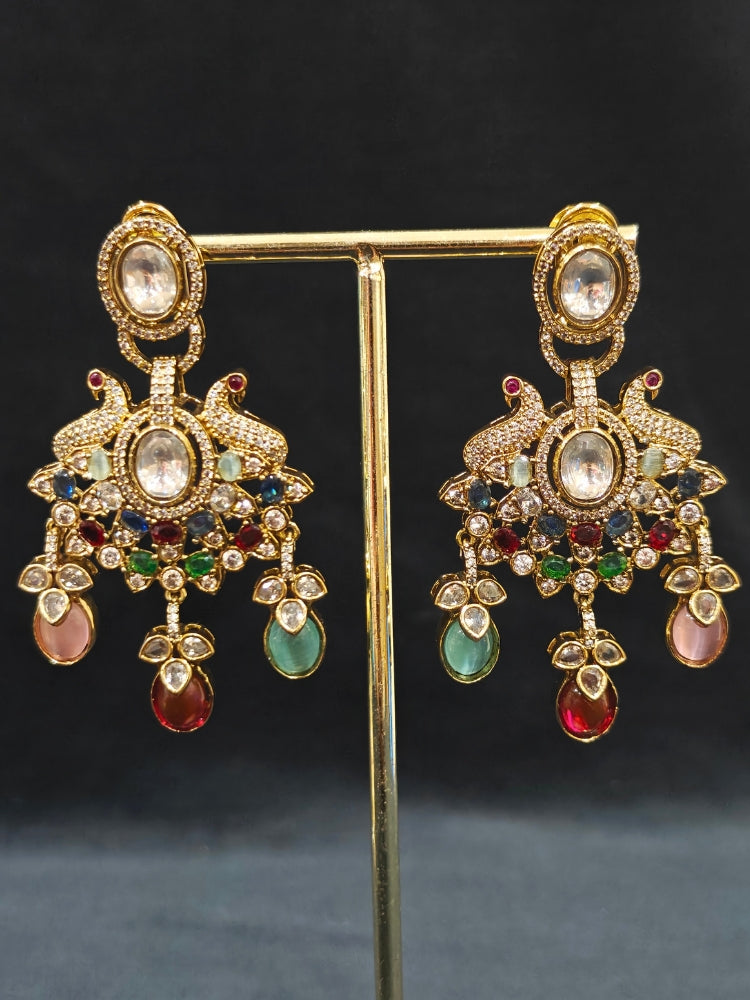 Close-up of an ornate traditional American diamond & Color stone gold jewellery set and earrings with American Diamond, Colored Stones, Kundan and Polki. A graceful trending American diamond necklace for a 2026 wedding celebration.