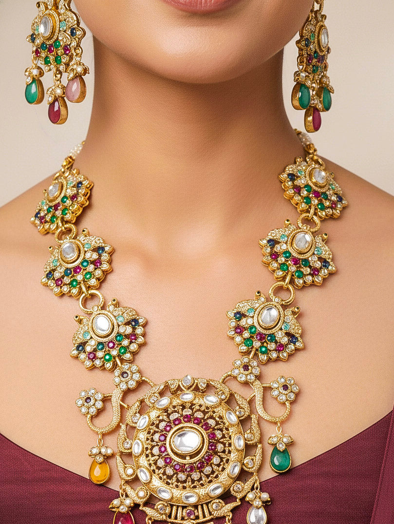 Close-up of a woman wearing an ornate traditional American diamond & Color stone gold jewellery set and earrings with American Diamond, Colored Stones, Kundan and Polki. A graceful trending American diamond necklace for a 2026 wedding celebration.