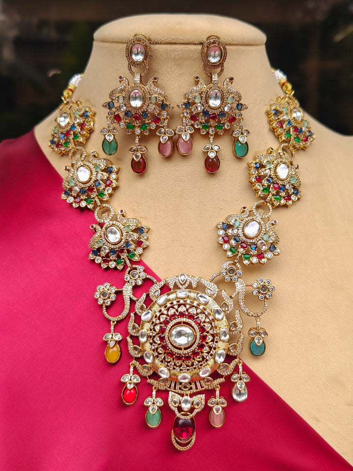 Close-up of an ornate traditional American diamond & Color stone gold jewellery set and earrings with American Diamond, Colored Stones, Kundan and Polki. A graceful trending American diamond necklace for a 2026 wedding celebration.