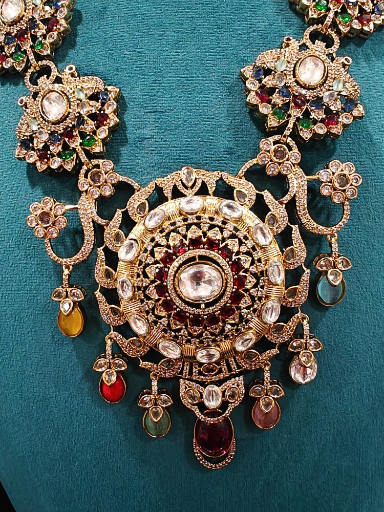 Close-up of an ornate traditional American diamond & Color stone gold jewellery set and earrings with American Diamond, Colored Stones, Kundan and Polki. A graceful trending American diamond necklace for a 2026 wedding celebration.