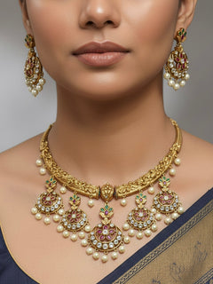 Close-up of a woman wearing an ornate traditional (Gold Polish) Hasli Collar Jewellery Set and Earrings with American Diamond, Colored Stones and Pearls. Woman wearing lightweight artificial American Diamond Hasli jewelry for long wedding functions. Woman wearing Hasli American Diamond artificial jewelry for a grand celebration.