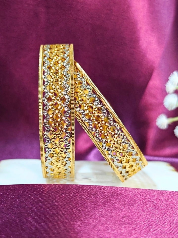 Close-up of an ornate traditional (Gold Polish) Gold & Silver Bangles Set. It’s comfortable and lightweight enough for everyday wear, and it also looks absolutely beautiful and elegant. The design is stylish, the finish is impressive, and it feels really pleasant to wear all day.