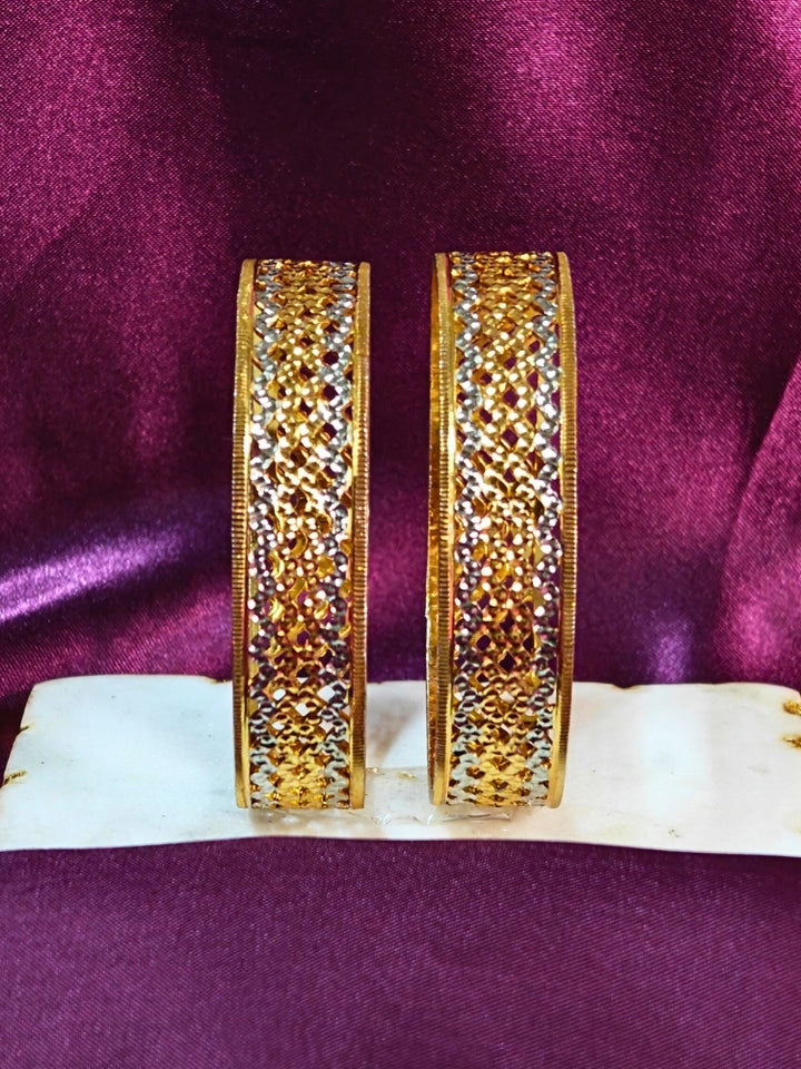 Close-up of an ornate traditional (Gold Polish) Gold & Silver Bangles Set. It’s comfortable and lightweight enough for everyday wear, and it also looks absolutely beautiful and elegant. The design is stylish, the finish is impressive, and it feels really pleasant to wear all day.