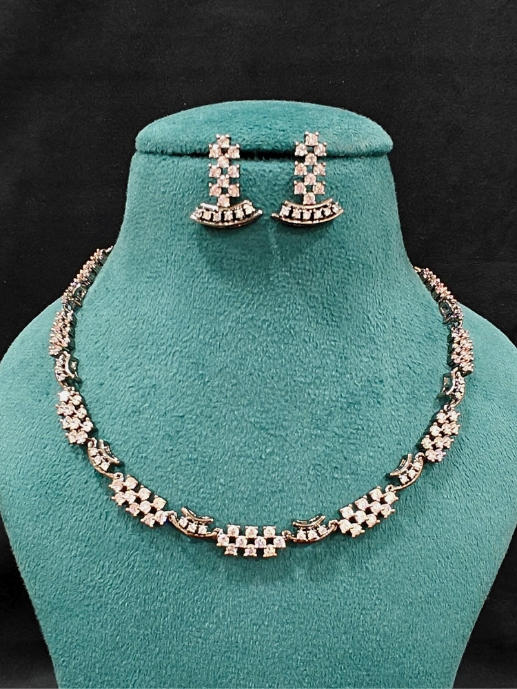Close-up of an ornate Western (Black Polish Victorian Finish Polish) Black Diamond Necklace set and earrings with American Diamond. A premium Diamond artificial jewelry set for reception night. Elegant reception look featuring a luxury American Diamond artificial jewelry set.