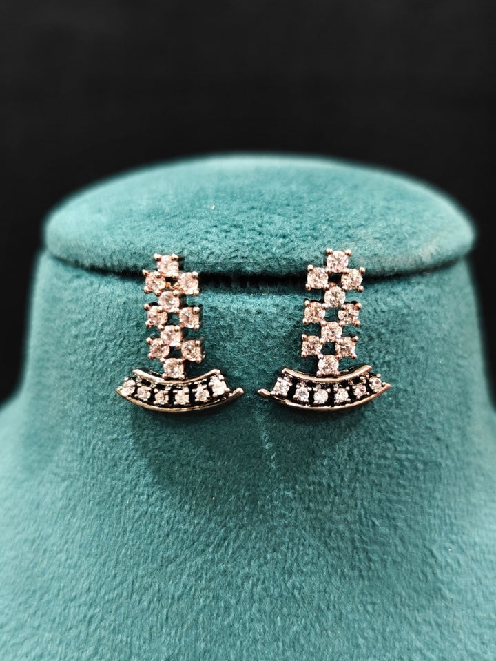 Close-up of an ornate Western (Black Polish Victorian Finish Polish) Black Diamond Necklace set and earrings with American Diamond. A premium Diamond artificial jewelry set for reception night. Elegant reception look featuring a luxury American Diamond artificial jewelry set.