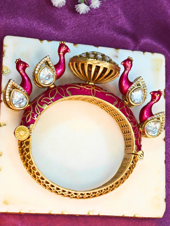 Close-up of an ornate traditional Pink Meenakari Bracelet with Meenakari, American Diamond and Kundan. A vibrant Meenakari artificial jewelry set for celebrations. Close-up of enamel work in Meenakari artificial wedding jewelry.