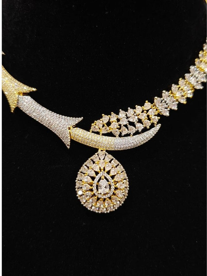 Close-up of an ornate Western (Dual Tone) Gold & Silver Collar jewellery set and earrings with American Diamond. Party wear outfit completed with a lightweight American diamond necklace. Close-up of a cocktail party look featuring a premium American diamond necklace.