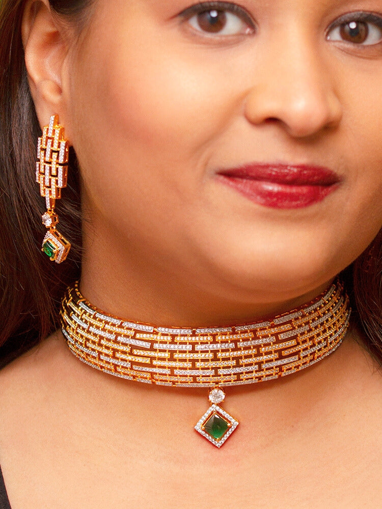 A bride-to-be wearing an exquisite artificial diamond choker necklace with emerald green colored stone and matching earrings, designed for the perfect engagement look. This stunning artificial diamond jewelry set offers luxury and sophistication while being an affordable alternative to natural diamonds.