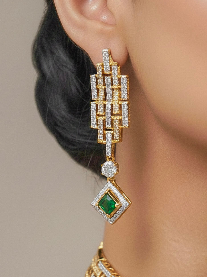 Close-up of a woman wearing an ornate Indo-Western American Diamond gold & Silver Choker jewellery set and earrings with American Diamond and Green Colored Stones. Woman wearing anti-tarnish artificial American Diamond Necklace Set for long functions. Perfect American Diamond necklace set for weddings and festivals.