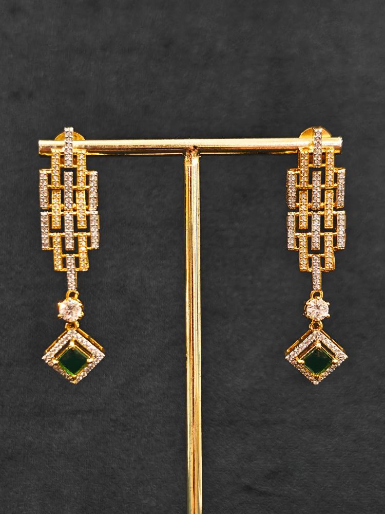 Close-up of an ornate Indo-Western American Diamond gold & Silver Choker jewellery set and earrings with American Diamond and Green Colored Stones. Anti-tarnish artificial American Diamond Necklace Set for long functions. Perfect American Diamond necklace set for weddings and festivals.