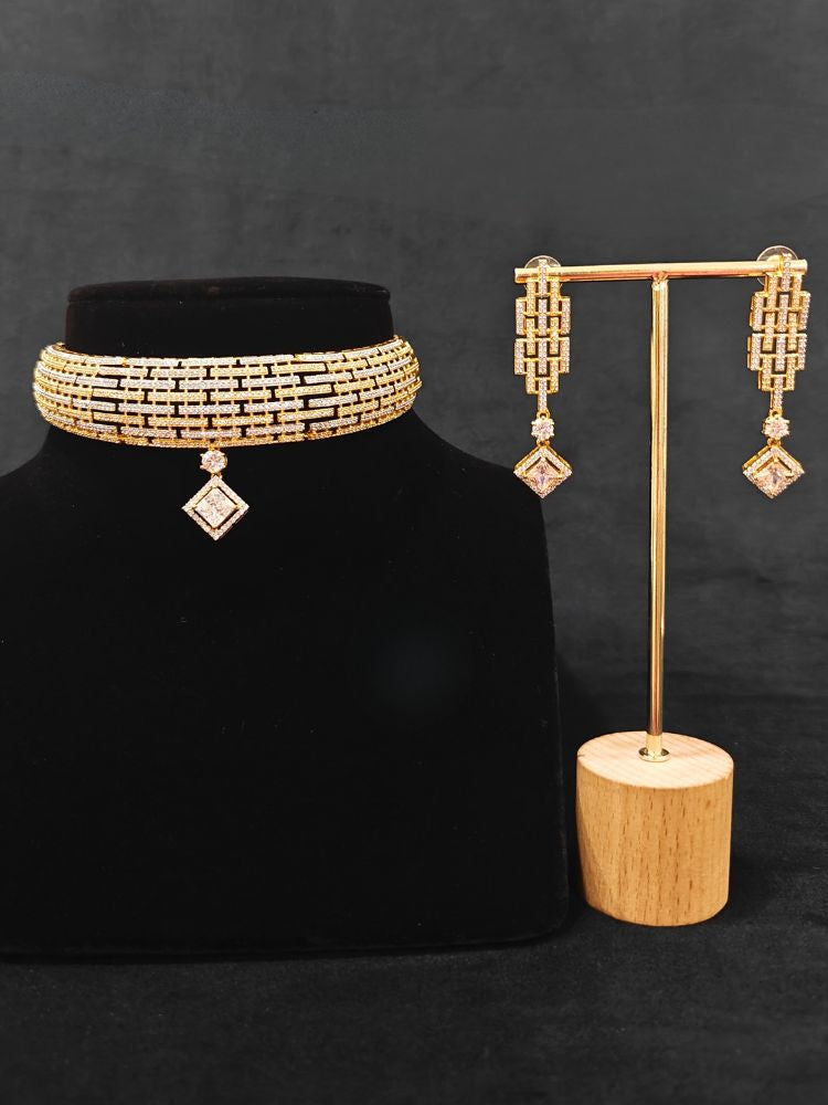 Close-up of an ornate Indo-Western American Diamond gold & Silver Choker jewellery set and earrings with American Diamond. Anti-tarnish artificial American Diamond Necklace Set for long functions. Perfect American Diamond necklace set for weddings and festivals.