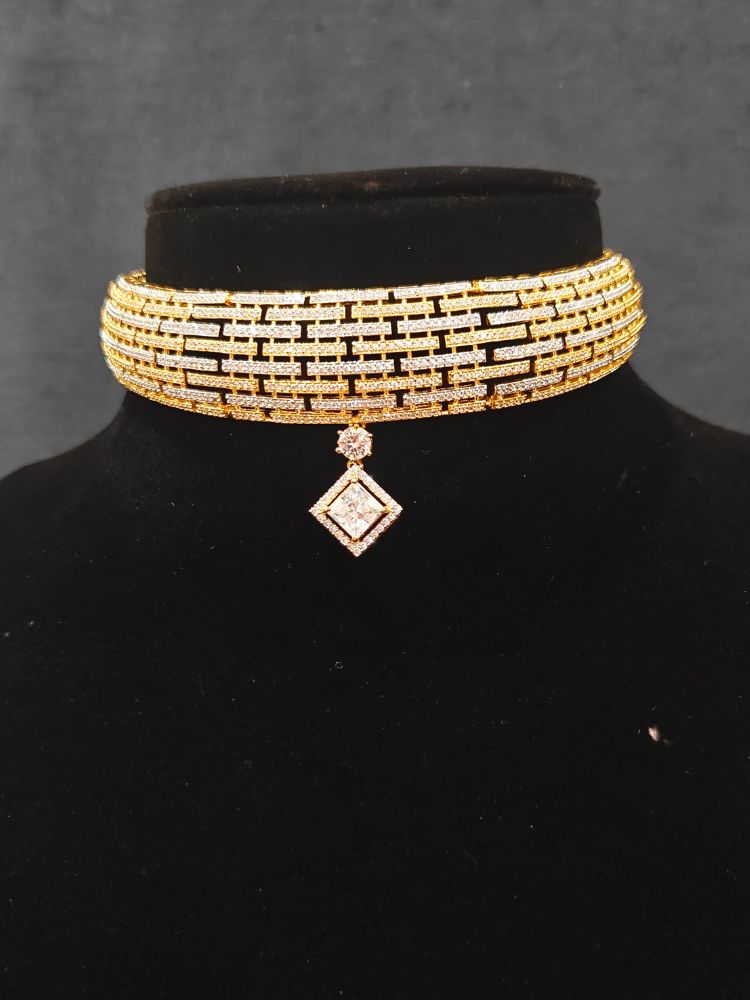 Close-up of an ornate Indo-Western American Diamond gold & Silver Choker jewellery set and earrings with American Diamond. Anti-tarnish artificial American Diamond Necklace Set for long functions. Perfect American Diamond necklace set for weddings and festivals.