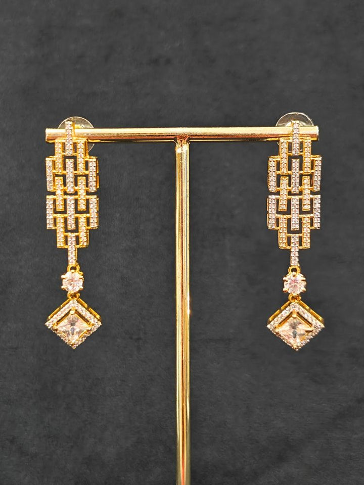 Close-up of an ornate Indo-Western American Diamond gold & Silver Choker jewellery set and earrings with American Diamond. Anti-tarnish artificial American Diamond Necklace Set for long functions. Perfect American Diamond necklace set for weddings and festivals.