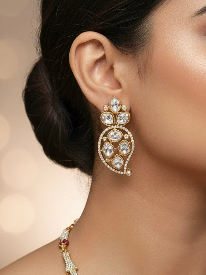 "Elegant woman wearing a luxurious artificial diamond, polki and green colored stone necklace with matching earrings, perfect for high-profile wedding receptions and formal galas. This high-end artificial diamond jewelry set combines style, elegance, and affordability for special occasions."