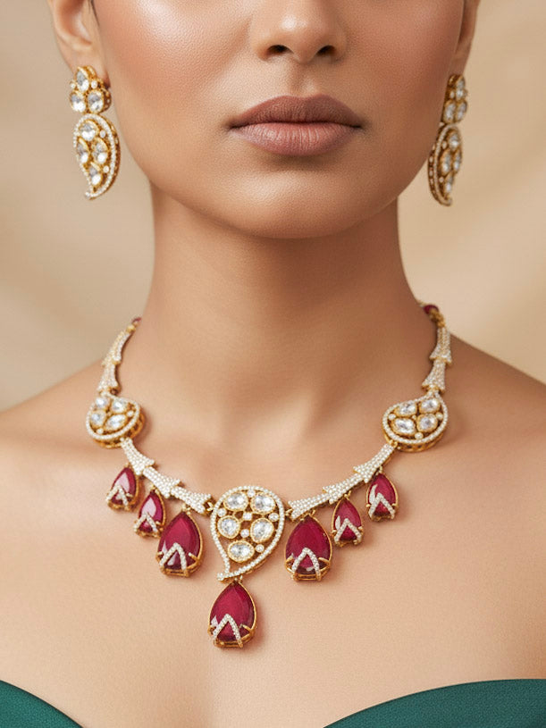"A woman in a traditional saree, wearing a gorgeous artificial diamond and red colored stone necklace paired with diamond earrings. This artificial diamond jewelry set offers a traditional yet modern touch for Indian brides, designed to add elegance and sophistication to any occasion."
