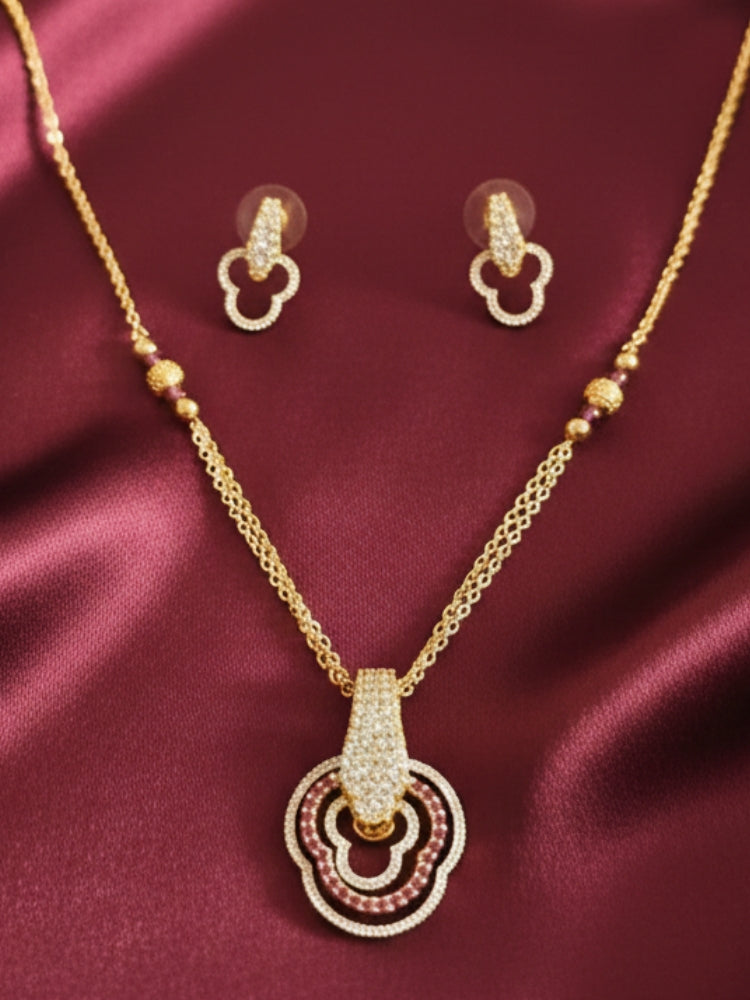 Close-up of an ornate Indo-Western (Gold Polish) Multi-Color Diamond Pendant Set with American Diamond and Colored Stones. Close-up of a bridal look featuring an anti-tarnish American diamond artificial Pendant Set. Elegant festive look with a high-quality imitation American diamond Pendant set.