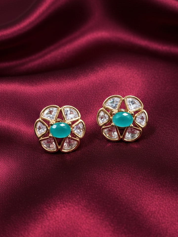 Close-up of a woman wearing an ornate Indo-Western (Rose Gold Polish) Mint Green Studs Earrings with Mint Green Colored Stone and Polki. Indo-western outfit styled with a statement Polki Studs Earrings. Perfect and comfortable for office or everyday use.