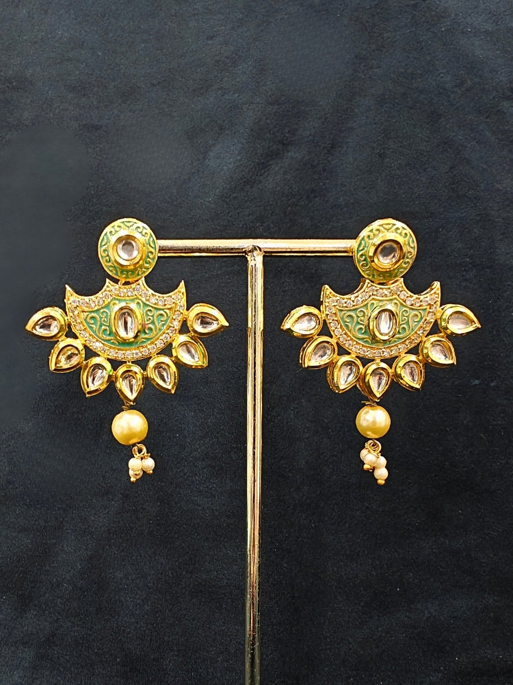 Close-up of an ornate traditional Mint Green Meenakari Long  jewellery set and earrings with Kundan, Meenakari work, crystal beads, pearls and American Diamond. Close-up of enamel work in Meenakari artificial wedding jewelry. Perfect Meenakari necklace set for weddings and festivals.