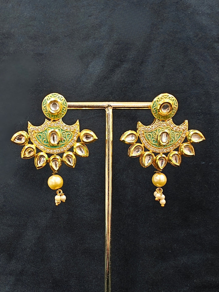 Close-up of an ornate traditional Mint Green Meenakari Long  jewellery set and earrings with Kundan, Meenakari work, crystal beads, pearls and American Diamond. Close-up of enamel work in Meenakari artificial wedding jewelry. Perfect Meenakari necklace set for weddings and festivals.