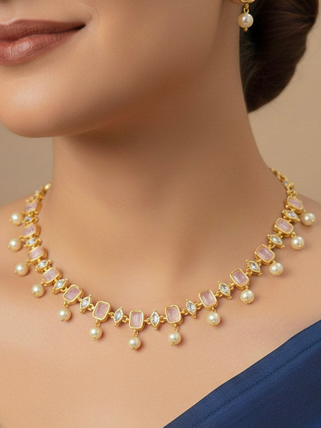 Close-up of a woman wearing an ornate traditional (Gold Polish) Mint Pink Choker jewellery set and earrings with Colored Stones, Pearl and American Diamonds. Festive Diwali outfit styled with an Colored Stones artificial necklace. Mehendi function outfit styled with a Colored Stone  necklace set.