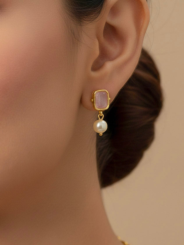 Close-up of a woman wearing an ornate traditional (Gold Polish) Mint Pink Choker jewellery set and earrings with Colored Stones, Pearl and American Diamonds. Festive Diwali outfit styled with an Colored Stones artificial necklace. Mehendi function outfit styled with a Colored Stone  necklace set.