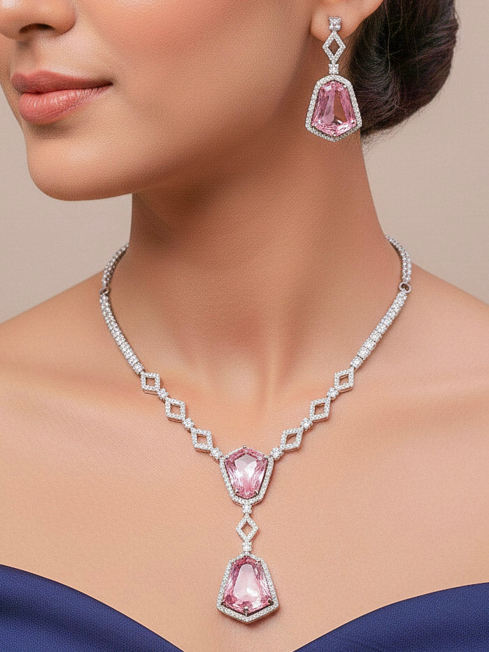 Close-up of a woman wearing an ornate Western Mint Pink (Silver Polish) Diamond jewellery set and earrings with American Diamond and Colored Stones. Festive Diwali outfit styled with an American diamond artificial necklace. Close-up of a party look featuring a premium American diamond necklace.