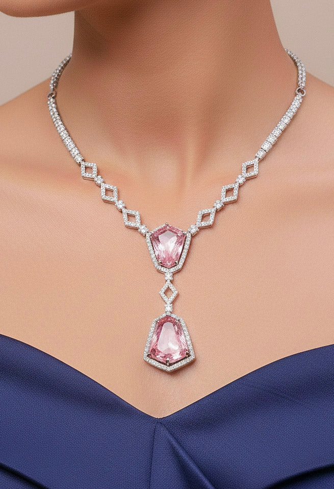 Close-up of a woman wearing an ornate Western Mint Pink (Silver Polish) Diamond jewellery set and earrings with American Diamond and Colored Stones. Festive Diwali outfit styled with an American diamond artificial necklace. Close-up of a party look featuring a premium American diamond necklace.