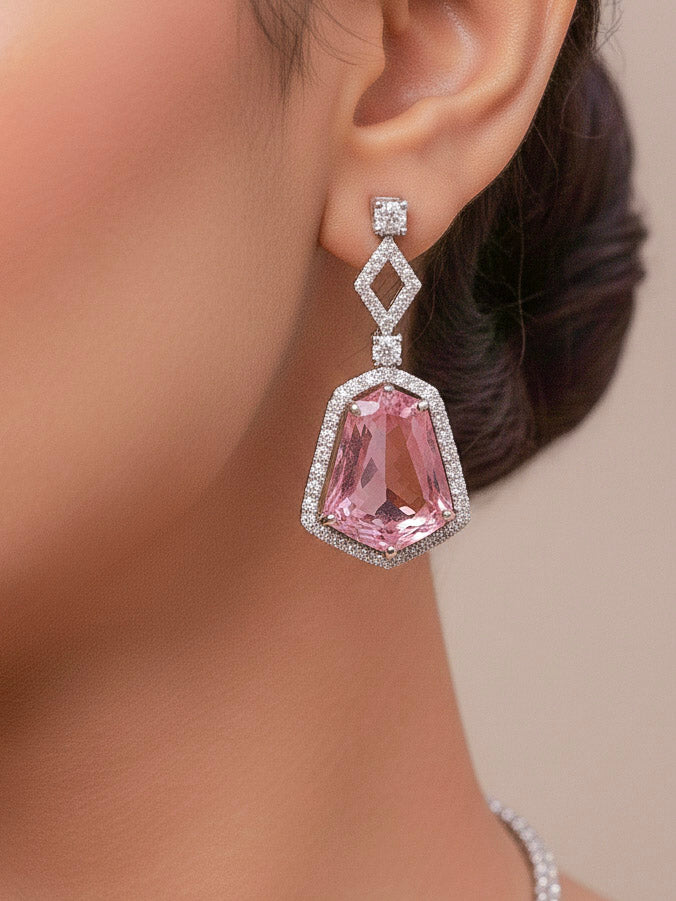 Close-up of a woman wearing an ornate Western Mint Pink (Silver Polish) Diamond jewellery set and earrings with American Diamond and Colored Stones. Festive Diwali outfit styled with an American diamond artificial necklace. Close-up of a party look featuring a premium American diamond necklace.