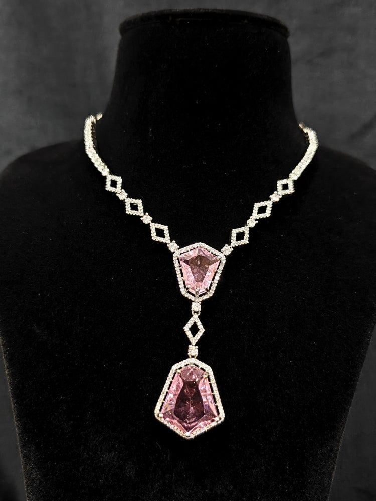 Close-up of an ornate Western Mint Pink (Silver Polish) Diamond jewellery set and earrings with American Diamond and Colored Stones. Festive Diwali outfit styled with an American diamond artificial necklace. Close-up of a party look featuring a premium American diamond necklace.