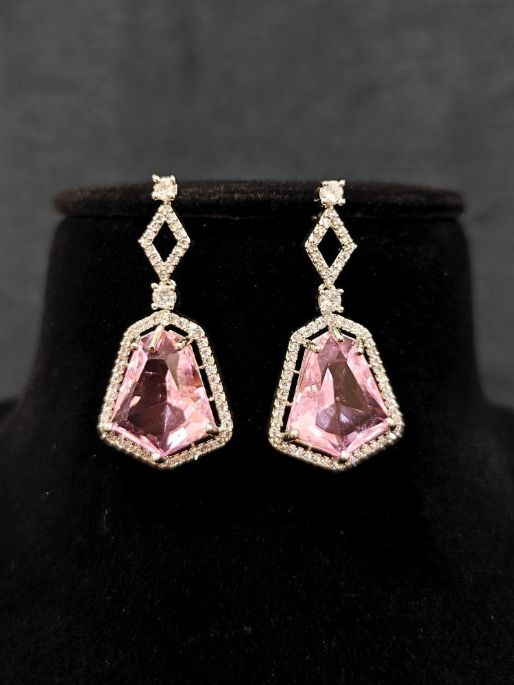 Close-up of an ornate Western Mint Pink (Silver Polish) Diamond jewellery set and earrings with American Diamond and Colored Stones. Festive Diwali outfit styled with an American diamond artificial necklace. Close-up of a party look featuring a premium American diamond necklace.