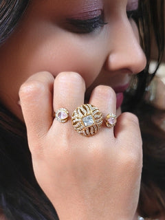 Close-up of a woman wearing an ornate Indo-Western (Mehendi Gold Polish Antique Finish) Mint Pink Diamond Ring with American Diamond, Colored Stones and Mozanite. Elegant festive look with a high-quality imitation American diamond Ring. Indo-western outfit styled with a statement American diamond Ring.