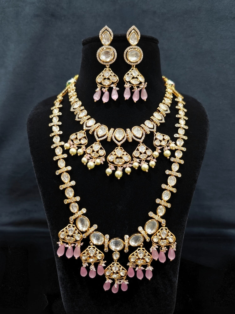 Close-up of an ornate traditional (Gold Polish) Long jewellery set and earrings with Polki, American Diamond, Tumble Beads and Pearls. Festive celebration look completed with premium imitation Polki jewelry. Woman wearing trending Polki artificial jewelry for the wedding season in India.