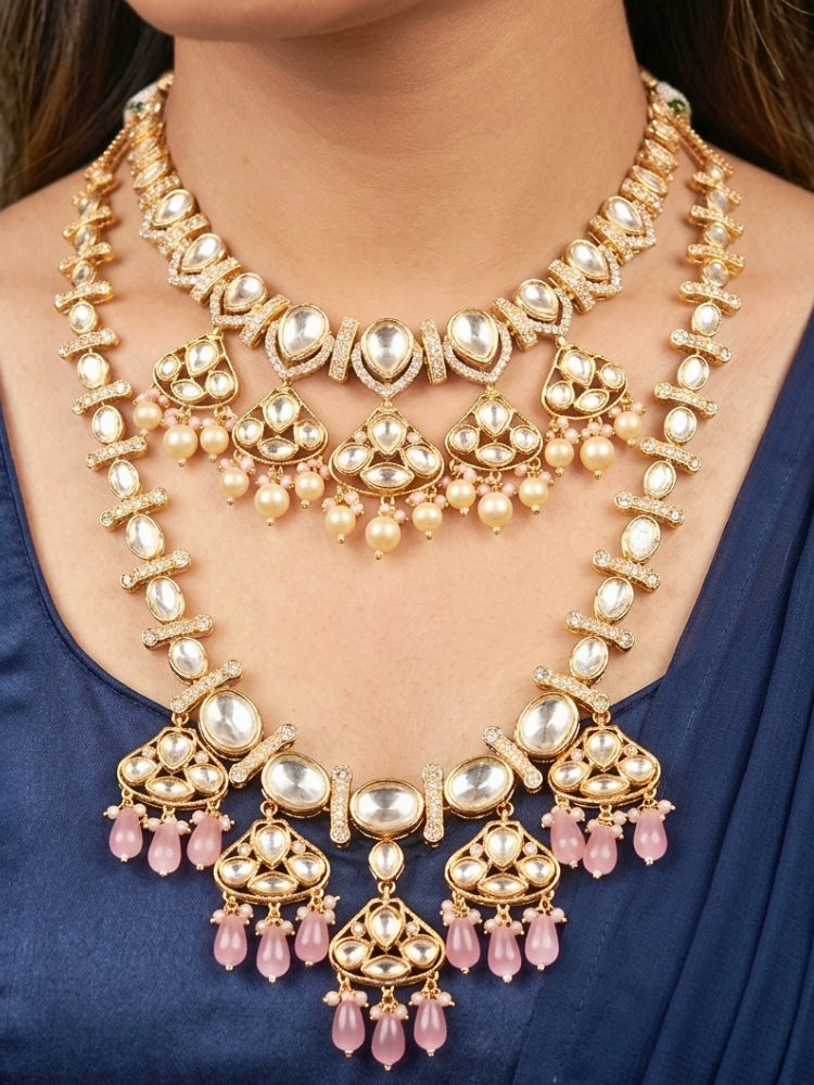 Close-up of a woman wearing an ornate traditional (Gold Polish) Long jewellery set and earrings with Polki, American Diamond, Tumble Beads and Pearls. Festive celebration look completed with premium imitation Polki jewelry.
Woman wearing trending Polki artificial jewelry for the wedding season in India.