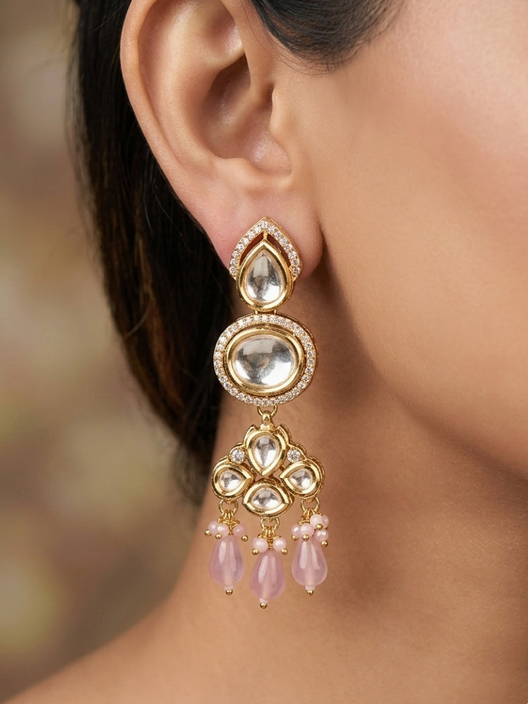 Close-up of a woman wearing an ornate traditional (Gold Polish) Long jewellery set and earrings with Polki, American Diamond, Tumble Beads and Pearls. Festive celebration look completed with premium imitation Polki jewelry.
Woman wearing trending Polki artificial jewelry for the wedding season in India.