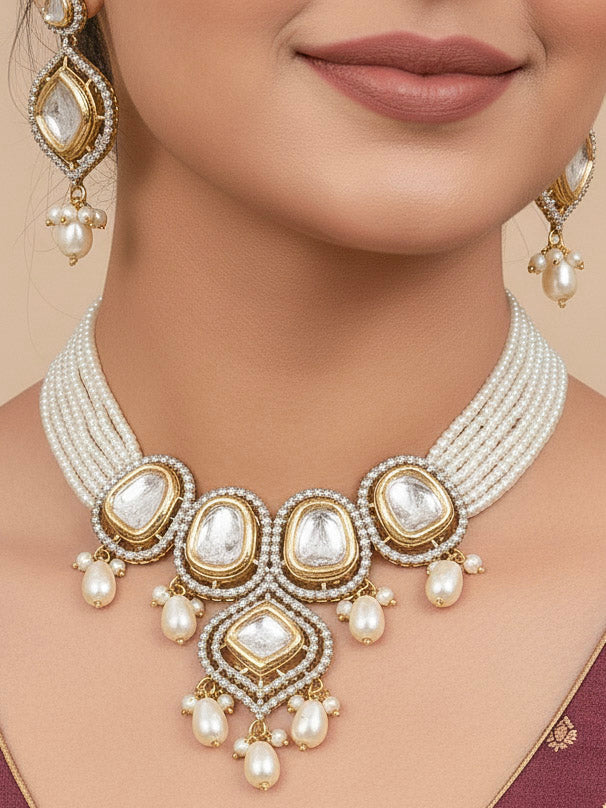 Close-up of a woman wearing an ornate traditional White Kundan Collar jewellery set and earrings with Moissanite Stones, American Diamonds, Pearls and Kundan. Reception party outfit paired with a luxury Kundan imitation jewelry set. Wedding celebration look enhanced with a statement Kundan necklace.