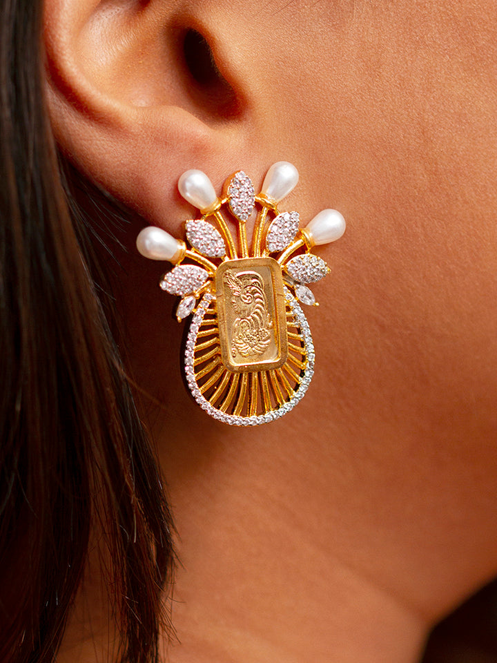 Close-up of a woman wearing an ornate traditional (Bright Gold Polish) Ginni jewellery set and earrings with American Diamond and Pearls. Party wear outfit completed with a lightweight American diamond Pendant Set. Close-up of a cocktail party look featuring a premium American diamond Pendant.