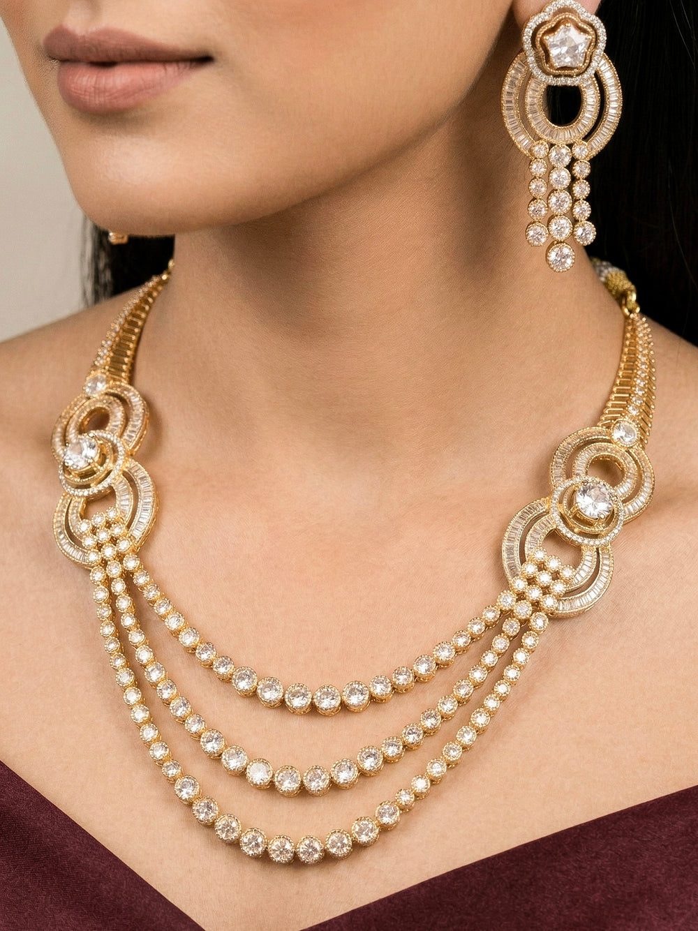 Close-up of a woman wearing an ornate Indo-Western jewellery set and earrings with American Diamond . Elegant Party look with a high-quality imitation American diamond necklace set. A graceful woman wearing a trending American diamond necklace for a 2026 wedding celebration.
