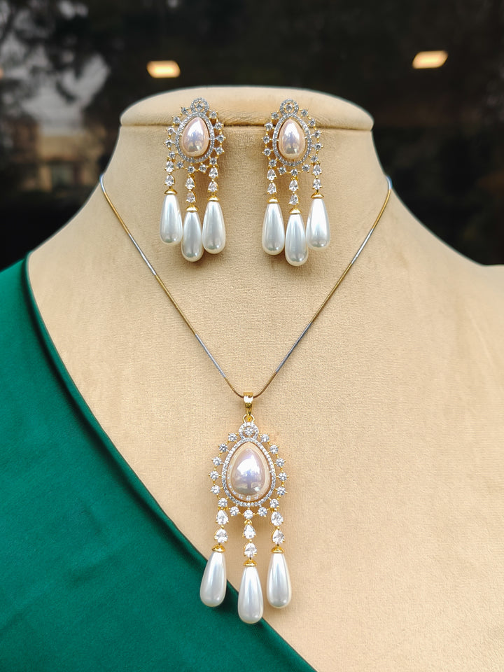 Close-up of an ornate Indo-western White Diamond Pendant set and earrings with Pearls and American Diamond. Festive Diwali outfit styled with an American diamond artificial Pendant. Party wear outfit completed with a lightweight American diamond Pendant.