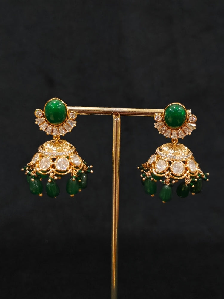 Close-up of an ornate traditional (Gold Polish) Choker Dark Green jewellery set and earrings with Crystal Beads, Polki, American Diamond, Colored Stones and Pearls. Festive Diwali look enhanced with a premium Polki artificial necklace. Festive saree look completed with Polki artificial jewelry set.