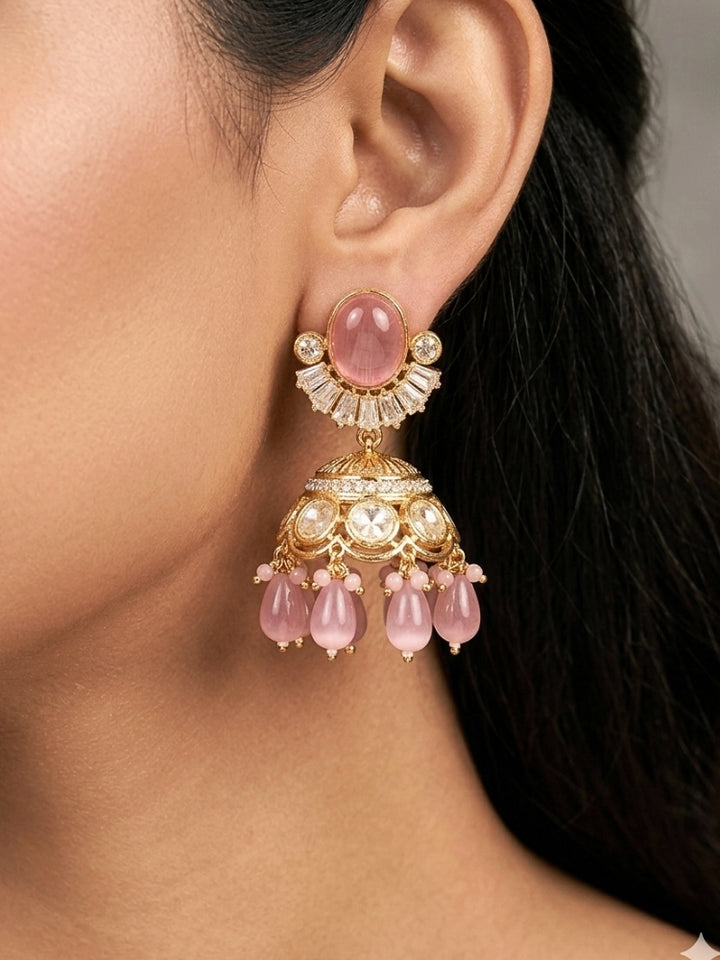 Close-up of a woman wearing an ornate traditional (Gold Polish) Choker Mint Pink jewellery set and earrings with Crystal Beads, Polki, American Diamond, Colored Stones and Pearls. Festive Diwali look enhanced with a premium Polki artificial necklace. Festive saree look completed with Polki artificial jewelry set.