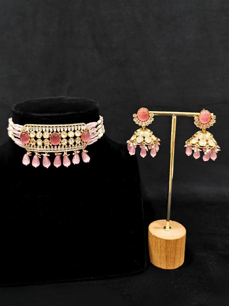 Close-up of an ornate traditional (Gold Polish) Choker Mint Pink jewellery set and earrings with Crystal Beads, Polki, American Diamond, Colored Stones and Pearls. Festive Diwali look enhanced with a premium Polki artificial necklace. Festive saree look completed with Polki artificial jewelry set.