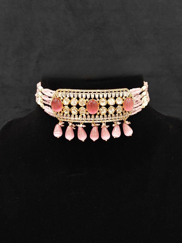 Close-up of an ornate traditional (Gold Polish) Choker Mint Pink jewellery set and earrings with Crystal Beads, Polki, American Diamond, Colored Stones and Pearls. Festive Diwali look enhanced with a premium Polki artificial necklace. Festive saree look completed with Polki artificial jewelry set.