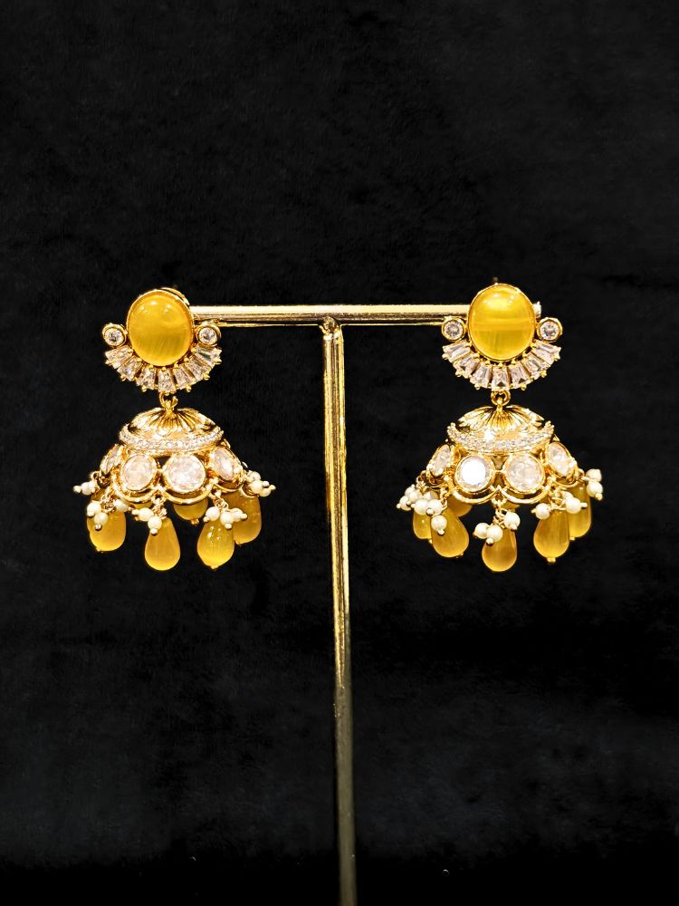 Close-up of an ornate traditional (Gold Polish) Choker Yellow jewellery set and earrings with Crystal Beads, Polki, American Diamond, Colored Stones and Pearls. Festive Diwali look enhanced with a premium Polki artificial necklace. Festive saree look completed with Polki artificial jewelry set.
