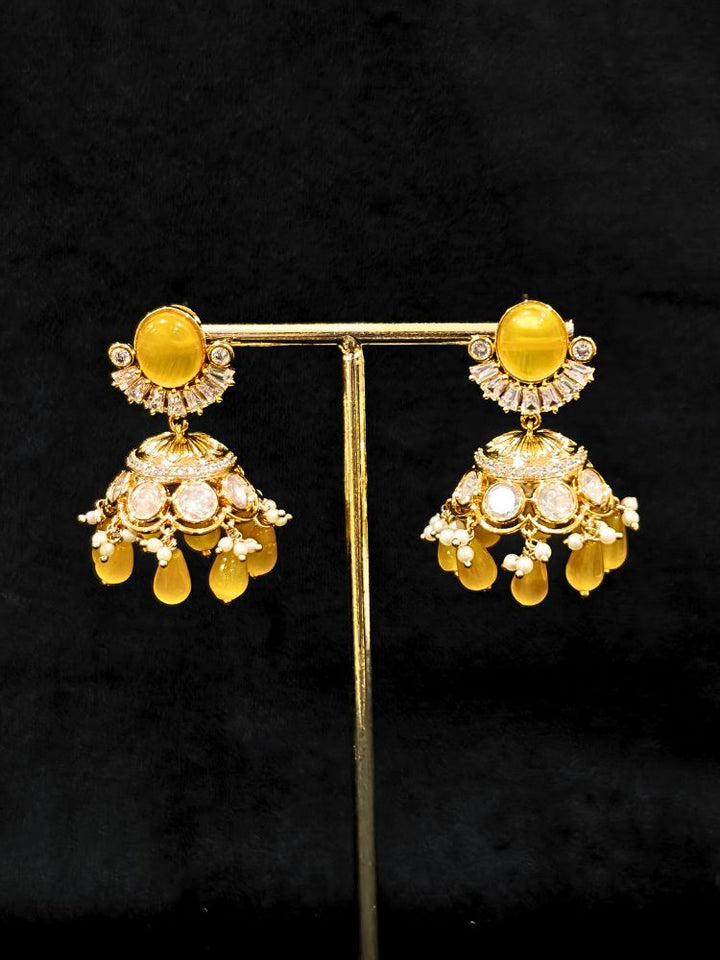 Close-up of an ornate traditional (Gold Polish) Choker Yellow jewellery set and earrings with Crystal Beads, Polki, American Diamond, Colored Stones and Pearls. Festive Diwali look enhanced with a premium Polki artificial necklace. Festive saree look completed with Polki artificial jewelry set.