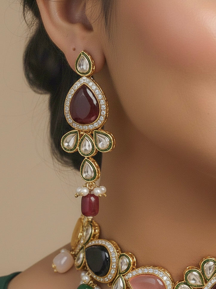 Close-up of a woman wearing an ornate traditional Multi-Color Choker jewellery set and earrings and maangtikka with Kundan, Monalisa Stone, American Diamonds, Beads and Reverse American Diamonds and tumble stones. A graceful woman wearing a trending Colored Stone necklace for a 2026 wedding celebration. Elegant wedding jewelry look featuring a premium artificial Colored Stone necklace.