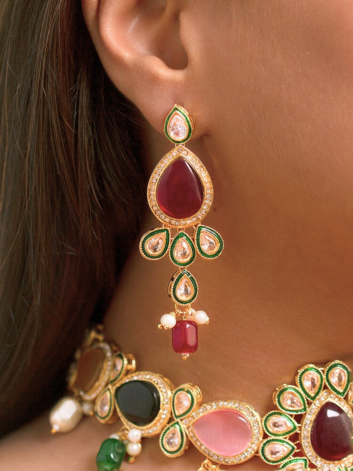 Close-up of a woman wearing an ornate traditional Multi-Color Choker jewellery set and earrings and maangtikka with Kundan, Monalisa Stone, American Diamonds, Beads and Reverse American Diamonds and tumble stones. A graceful woman wearing a trending Colored Stone necklace for a 2026 wedding celebration. Elegant wedding jewelry look featuring a premium artificial Colored Stone necklace.