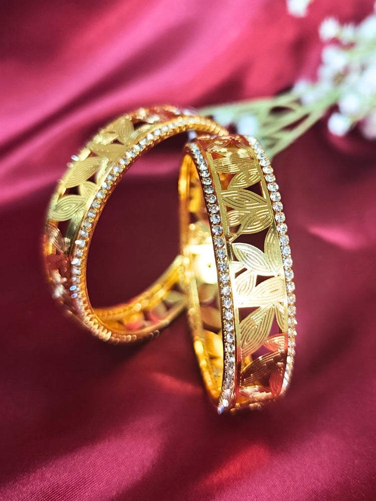 Close-up of an ornate traditional (Gold Polish) Bangles Set with American Diamond. A bridal artificial American Diamond bangles for a grand celebration. A anti-tarnish artificial American Diamond bangles for long functions.