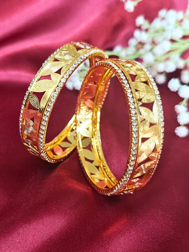 Close-up of an ornate traditional (Gold Polish) Bangles Set with American Diamond. A bridal artificial American Diamond bangles for a grand celebration. A anti-tarnish artificial American Diamond bangles for long functions.