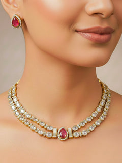 Close-up of a woman wearing an ornate Indo-western Red Collar Layered Diamond jewellery set and earrings with American Diamond and Colored Stones. Festive Diwali outfit styled with an American diamond artificial necklace. Party wear outfit completed with a lightweight American diamond necklace.